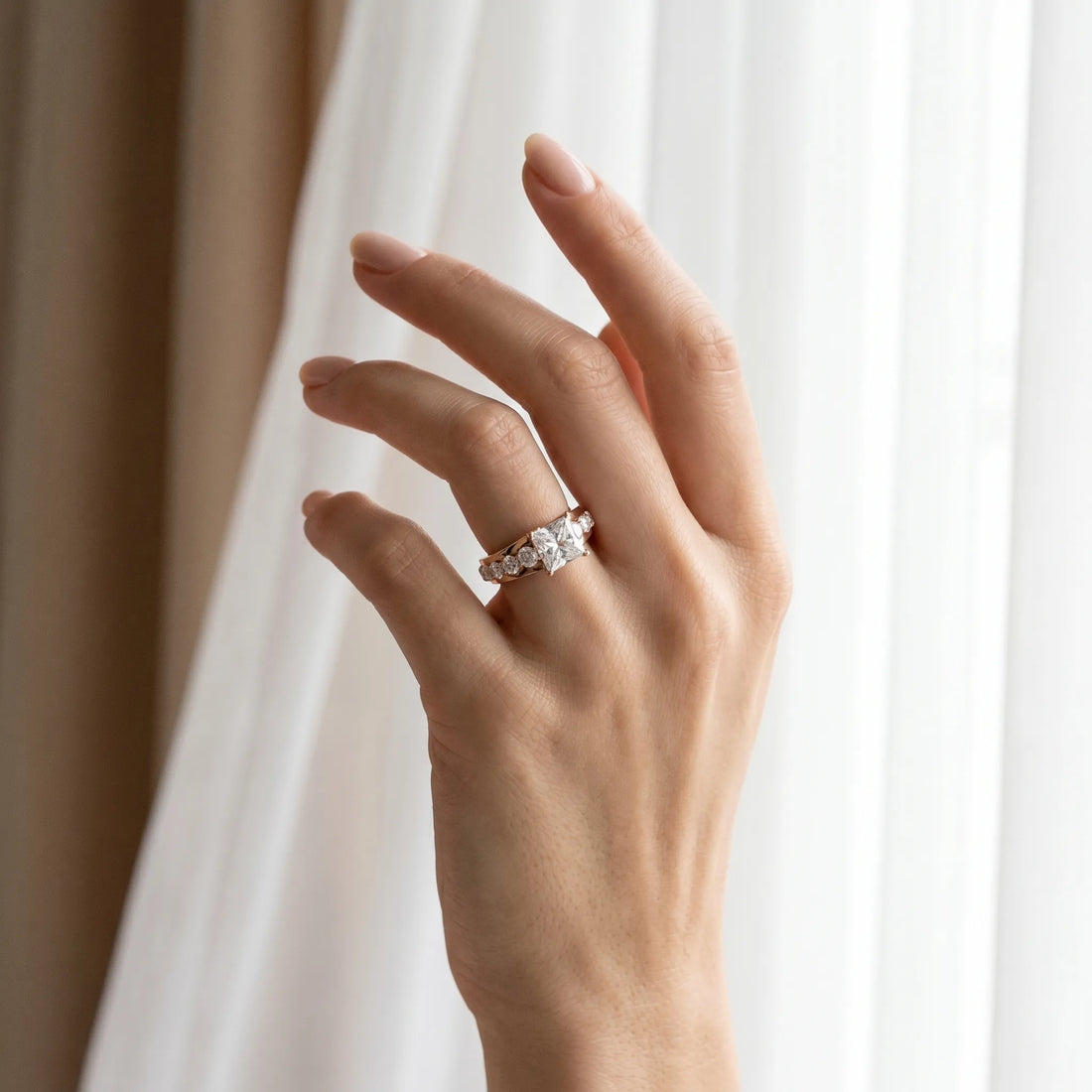 Rose gold Princess Brilliant Solitaire with Side Stones on a Pave Band and Four-Prong Setting_12