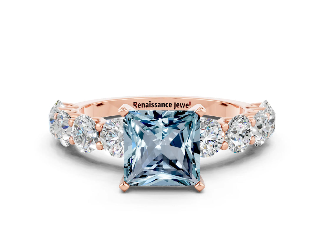 Rose gold Princess Cut Aquamarine Prong Setting with Side Stones on a Pave Band