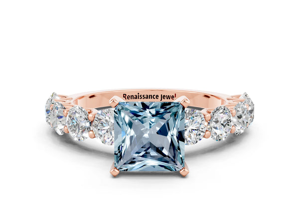 Rose gold Princess Cut Aquamarine Prong Setting with Side Stones on a Pave Band