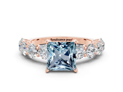 Rose gold Princess Cut Aquamarine Prong Setting with Side Stones on a Pave Band