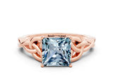 Rose gold Princess Cut Aquamarine Solitaire Engagement Ring with Celtic Knot Band and Four-Prong Setting
