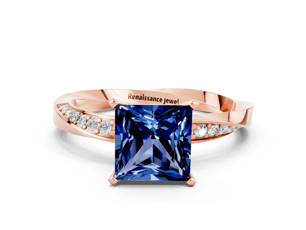 Rose gold Princess Cut Blue Sapphire Engagement Ring with Side Stone Accents and Four-Prong Setting