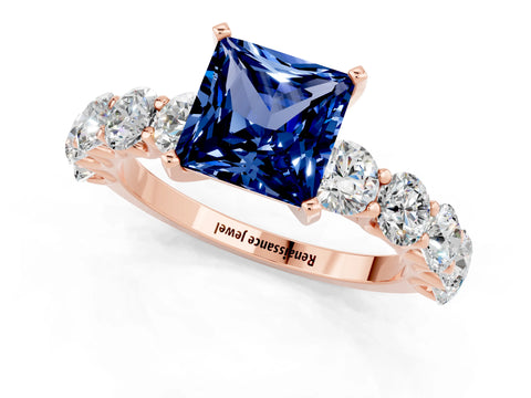 Rose gold Princess Cut Blue Sapphire Prong Setting with Side Stones on a Pave Band_1