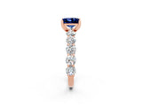Rose gold Princess Cut Blue Sapphire Prong Setting with Side Stones on a Pave Band_2