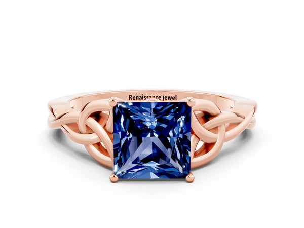 Rose gold Princess Cut Blue Sapphire Solitaire Engagement Ring with Celtic Knot Band and Four-Prong Setting