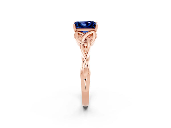 Rose gold Princess Cut Blue Sapphire Solitaire Engagement Ring with Celtic Knot Band and Four-Prong Setting