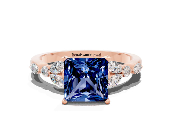 Rose gold Princess Cut Blue Sapphire Solitaire Ring with Side Stones and Four-Prong Setting