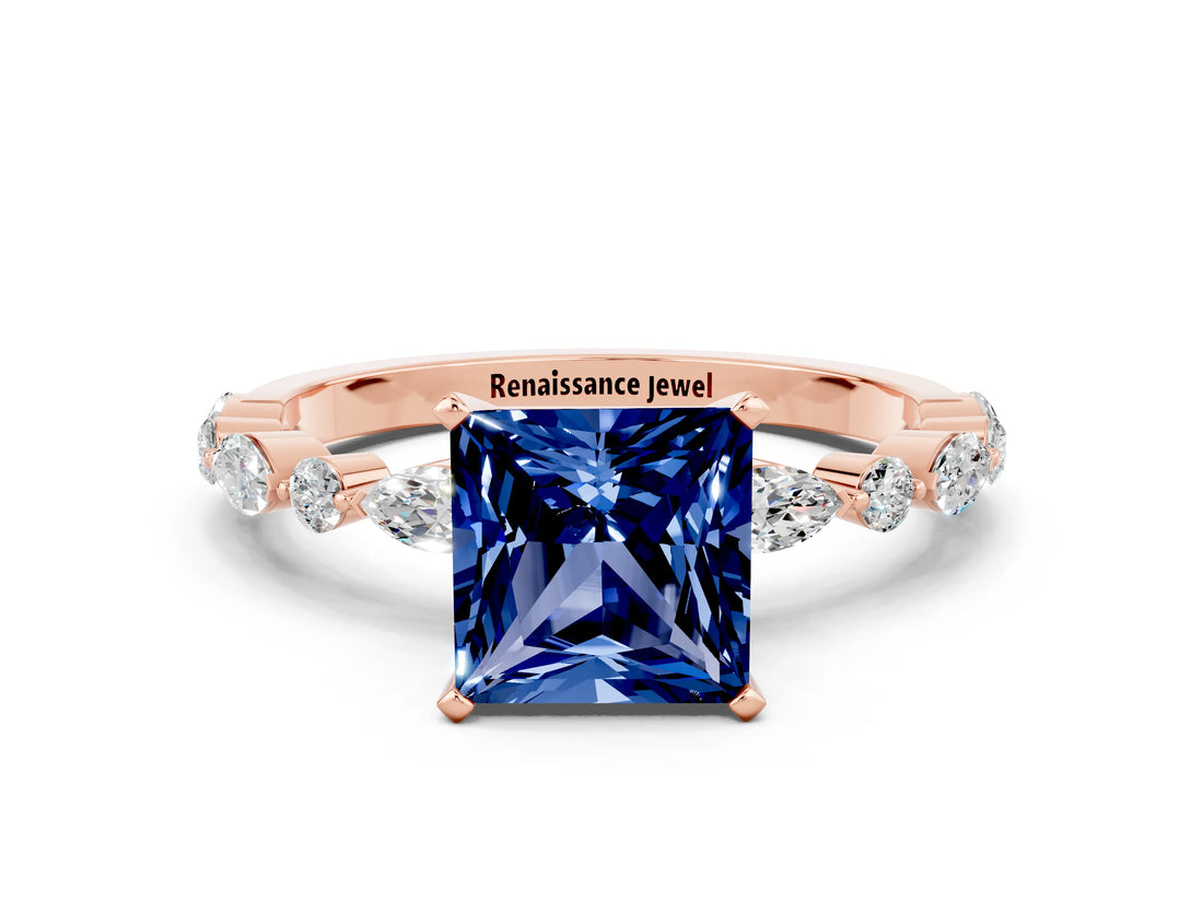 Rose gold Princess Cut Blue Sapphire Solitaire with Side Stones on a Pavé Band and Four-Prong Setting