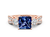 Rose gold Princess Cut Blue Sapphire Three-Stone Ring with Pavé Split Shank and Four-Prong Setting