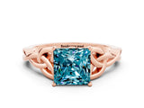 Rose gold Princess Cut Blue Topaz Solitaire Engagement Ring with Celtic Knot Band and Four-Prong Setting