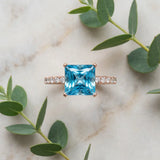 Rose gold Princess Cut Blue Topaz Solitaire Ring with Round  Pavé Band and Four-Prong Setting_57