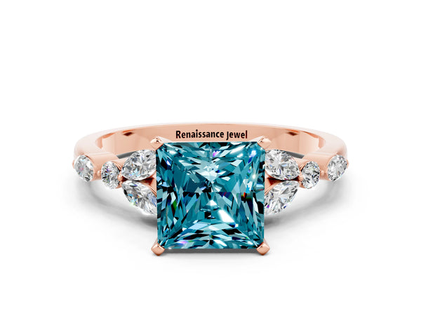 Rose gold Princess Cut Blue Topaz Solitaire Ring with Side Stones and Four-Prong Setting