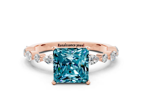 Rose gold Princess Cut Blue Topaz Solitaire with Side Stones on a Pavé Band and Four-Prong Setting