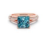 Rose gold Princess Cut Blue Topaz Split Shank Engagement Ring with Pavé Band