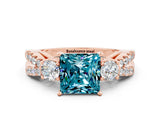 Rose gold Princess Cut Blue Topaz Three-Stone Ring with Pavé Split Shank and Four-Prong Setting