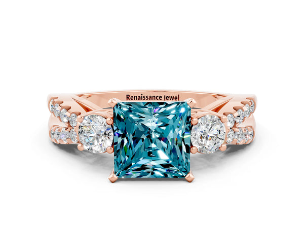 Rose gold Princess Cut Blue Topaz Three-Stone Ring with Pavé Split Shank and Four-Prong Setting