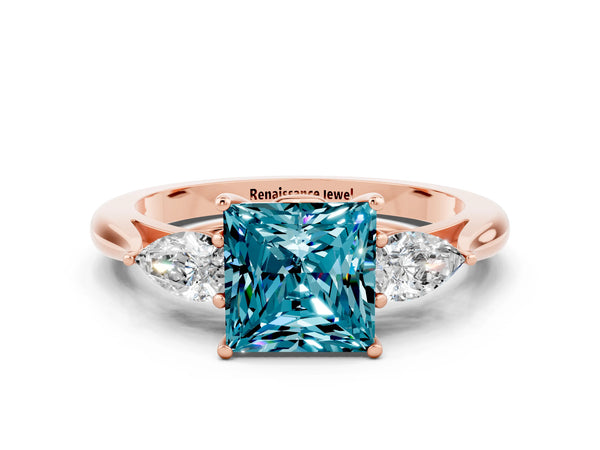 Rose gold Princess Cut Blue Topaz Three-Stone Ring with Pear  Side Stones and Prong Setting