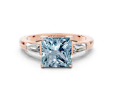 Rose gold Princess Cut Cut Diamond Ring with Tapered Baguette Side Stones in Four-Prong Setting