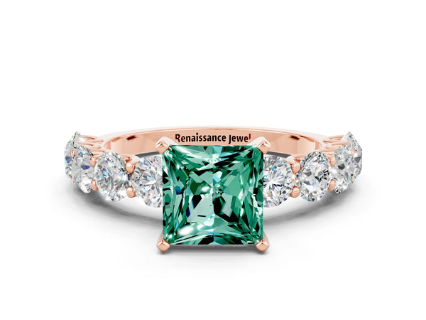 Rose gold Princess Cut Green Sapphire Prong Setting with Side Stones on a Pave Band