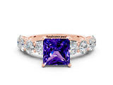 Rose gold Princess Cut Tanzanite Prong Setting with Side Stones on a Pave Band