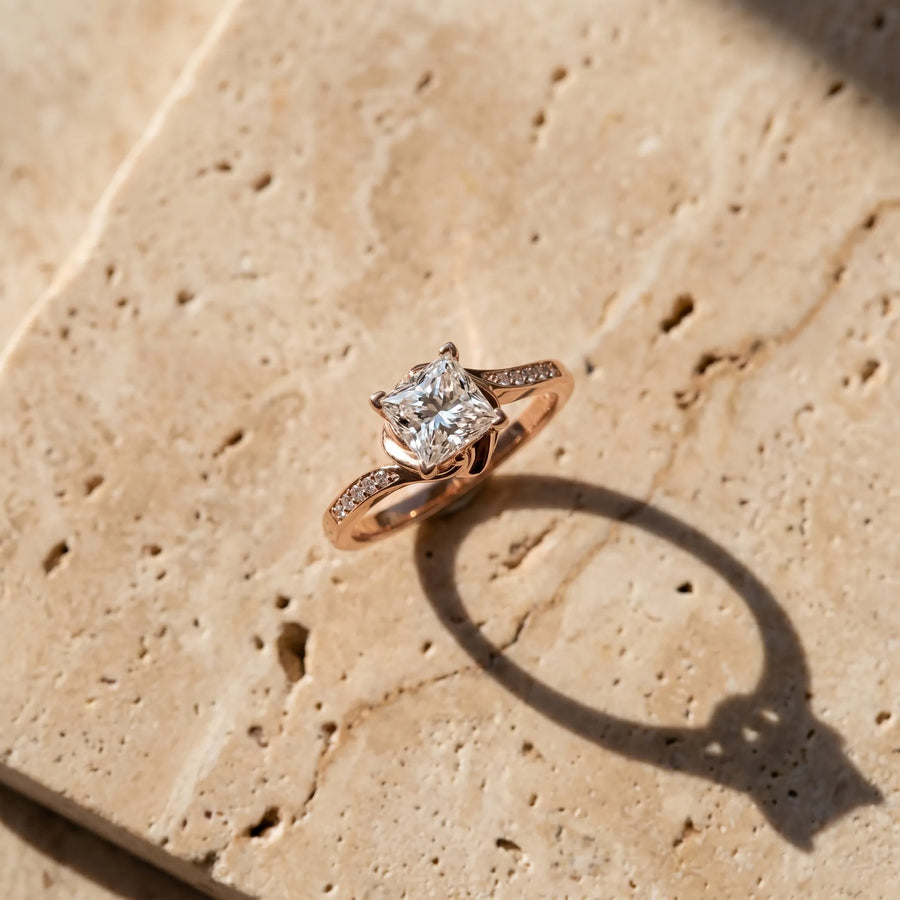 Rose gold Princess Solitaire Twist Band with Channel-Set Diamonds and Four-Prong Setting