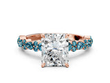 Rose gold Radiant Cut Diamond Side Stone Solitaire Ring with Round with Blue Topaz side stone and Four-Prong Setting