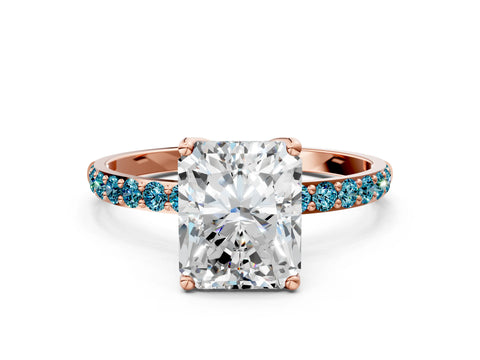 Rose gold Radiant Cut Diamond Solitaire Engagement Ring with Round with Blue Topaz side stone Pavé Band and Prong Setting