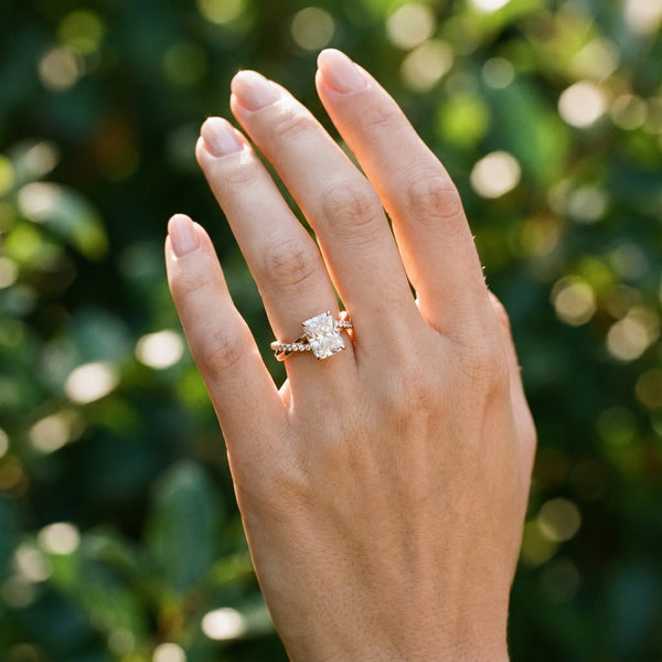 Rose gold Radiant Cut Diamond Twist Band Solitaire with Prong Setting