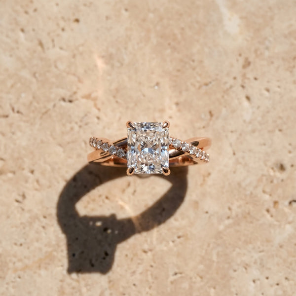 Rose gold Radiant Cut Diamond Twist Band Solitaire with Prong Setting