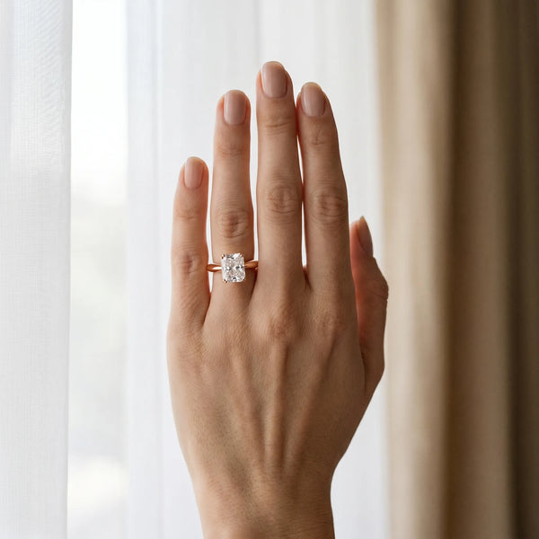 Rose gold Radiant Cut Solitaire Engagement Ring with Tapered Band and Four-Prong Setting