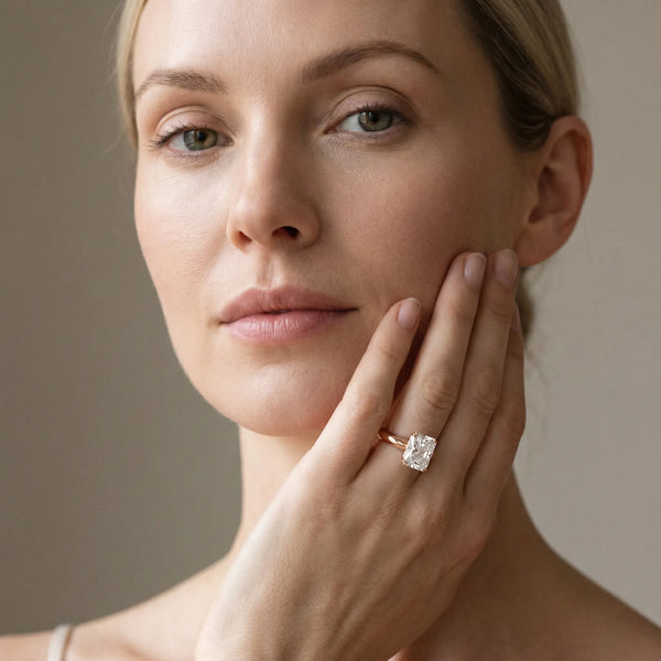 Rose gold Radiant Cut Solitaire Engagement Ring with Tapered Band and Four-Prong Setting