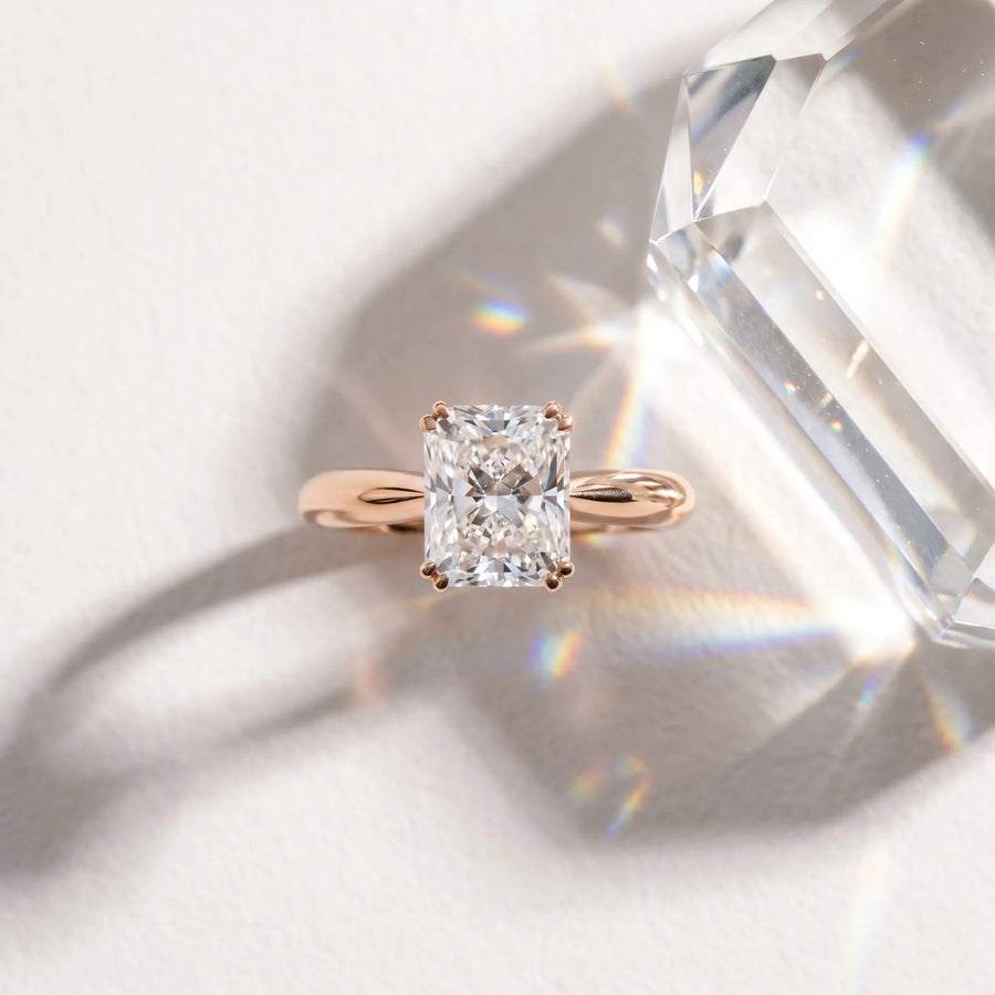 Rose gold Radiant Cut Solitaire Engagement Ring with Tapered Band and Four-Prong Setting