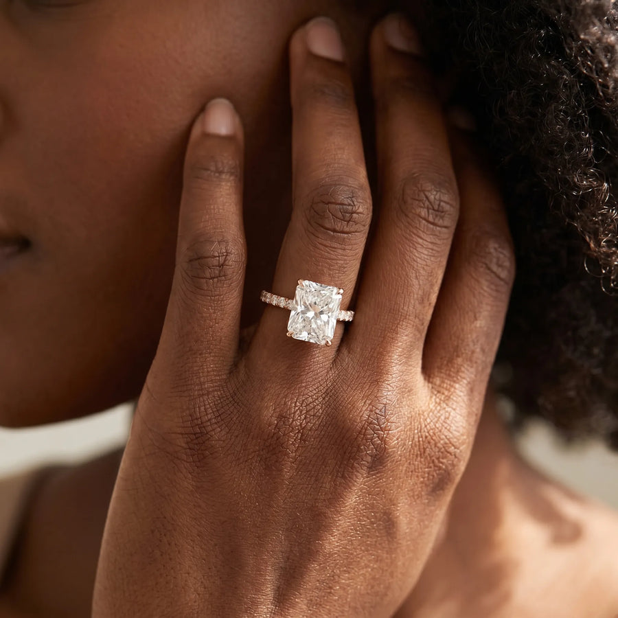 Rose gold Radiant Solitaire Diamond Engagement Ring with Four-Prong Setting on a Classic Band