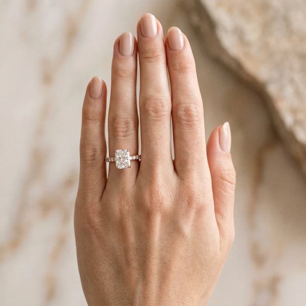 Rose gold Radiant Solitaire Diamond Engagement Ring with Pavé Band and Six-Prong Setting
