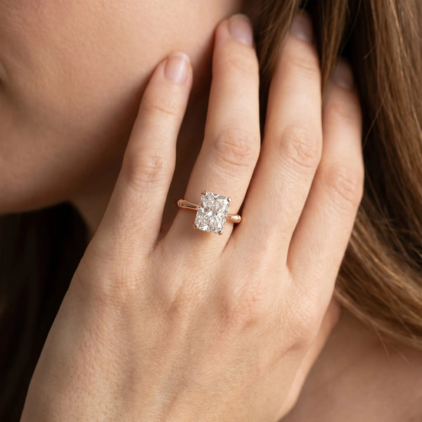 Rose gold Radiant Solitaire Diamond Ring with Bamboo Band and Four-Prong Setting