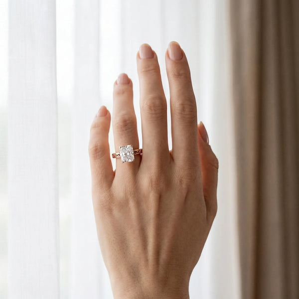 Rose gold Radiant Solitaire Engagement Ring with Scrollwork Band and Four-Prong Setting