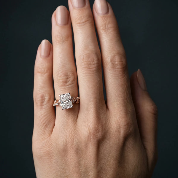 Rose gold Radiant Solitaire Leaf-Inspired Diamond Ring with Pavé Band and Four-Prong Setting