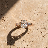 Rose gold Radiant Solitaire with Tapered Baguette Side Stones on a Classic Band with Four-Prong Setting_16