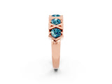 Rose gold Round Blue Topaz Channel Set Band with X-Prong Detail_8