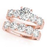 Rose gold Round Brilliant Diamond Five-Stone Engagement Ring with Prong Setting on a Classic Band