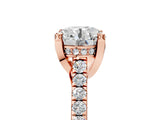 Rose gold Round Brilliant Diamond Solitaire with Pavé Band and Four-Prong Setting