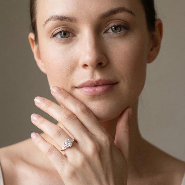 Rose gold Round Brilliant Diamond Solitaire with Side Stones on a Tapered Band and Four-Prong Setting