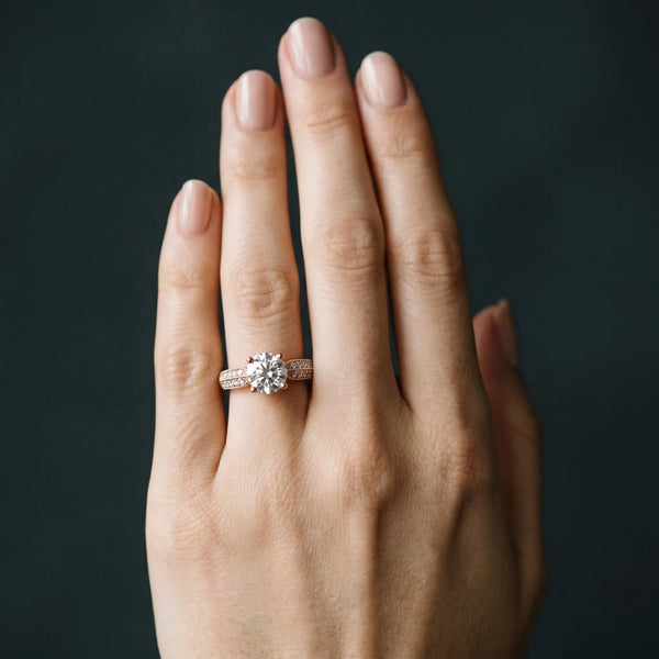 Rose gold Round Brilliant Solitaire Engagement Ring with Pave Band and Four-Prong Setting