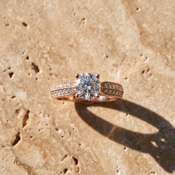 Rose gold Round Brilliant Solitaire Engagement Ring with Pave Band and Four-Prong Setting