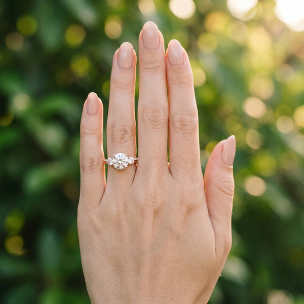 Rose gold Round Brilliant Three-Stone Diamond Ring with Pavé Band and Four-Prong Setting