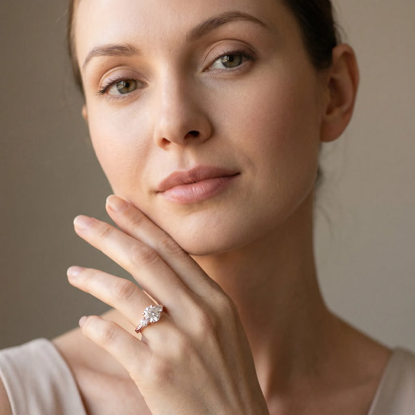 Rose gold Round Brilliant Three-Stone Diamond Ring with Pavé Band and Four-Prong Setting