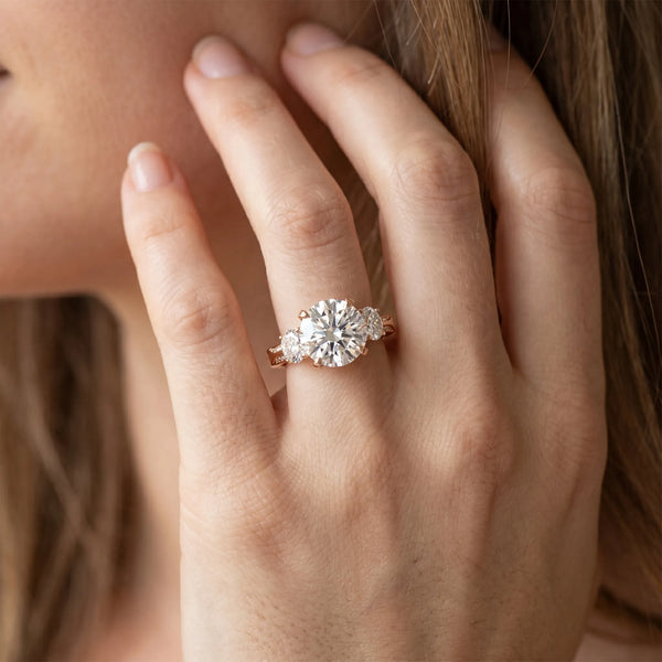 Rose gold Round Brilliant Three-Stone Diamond Ring with Pavé Band and Four-Prong Setting