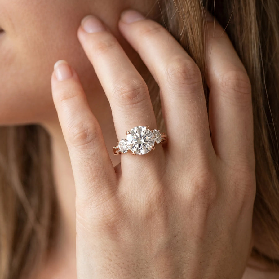 Rose gold Round Brilliant Three-Stone Diamond Ring with Pavé Band and Four-Prong Setting