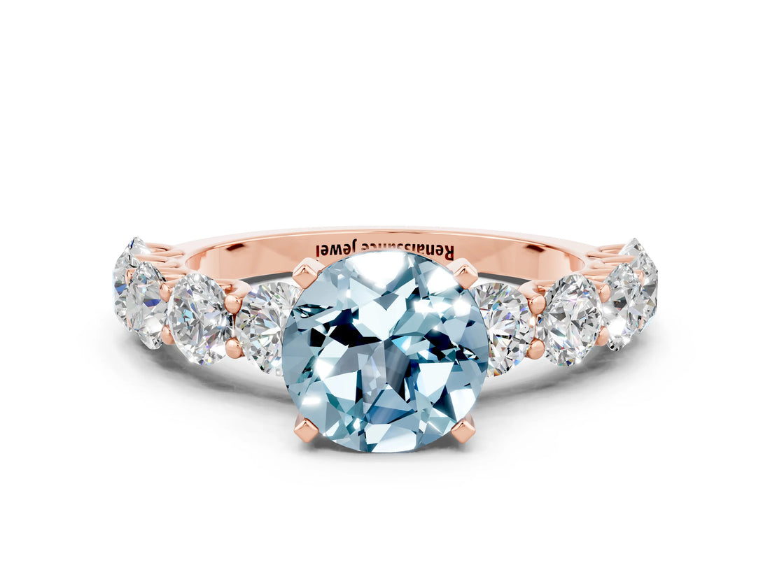 Rose gold Round Cut Aquamarine Prong Setting with Side Stones on a Pave Band