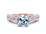 Rose gold Round Cut Aquamarine Prong Setting with Side Stones on a Pave Band